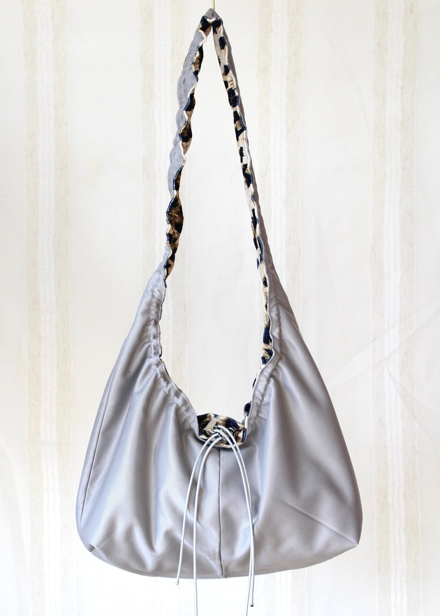 Silver leo bag