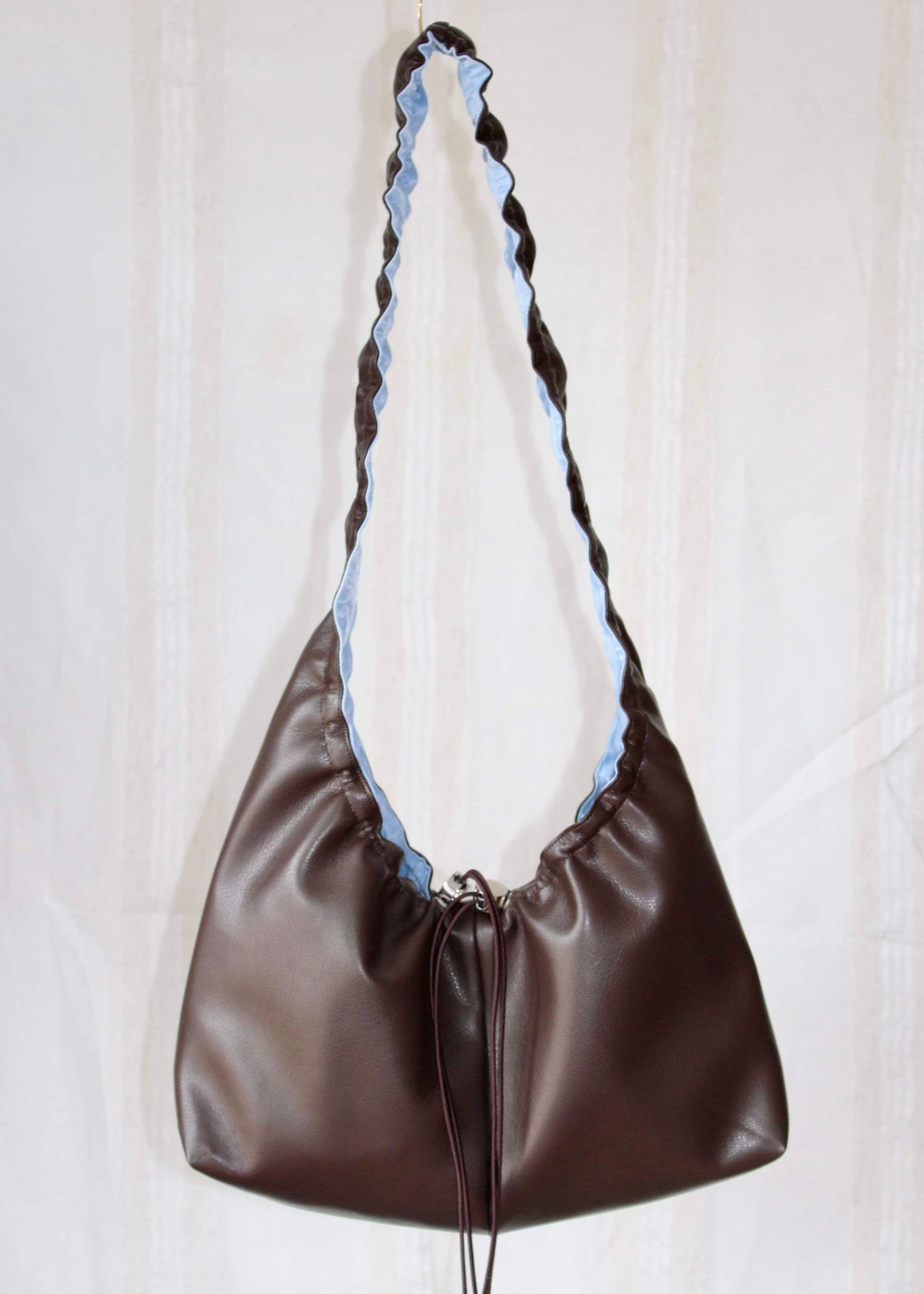 Dark brown and light blue bag