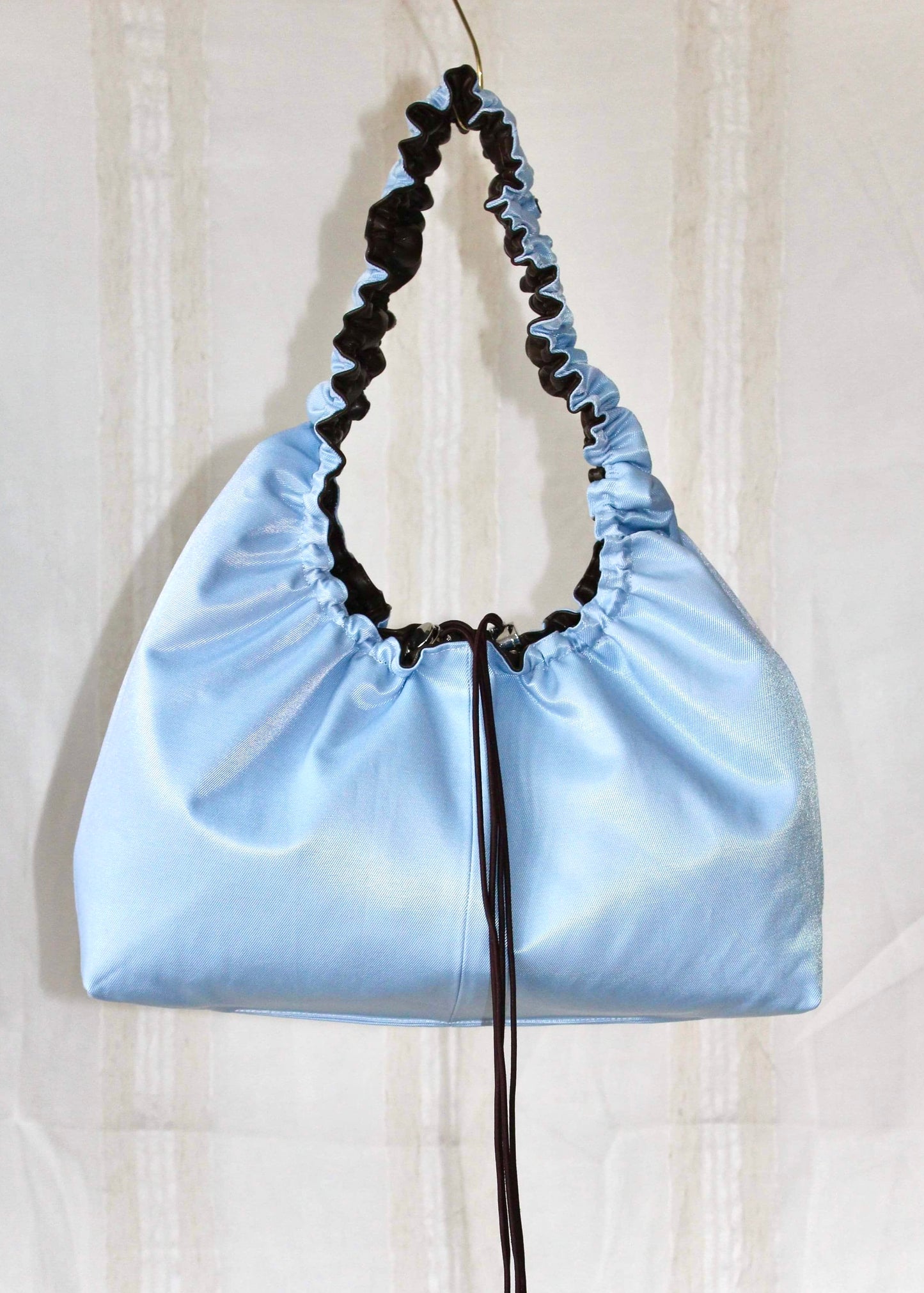 Dark brown and light blue bag