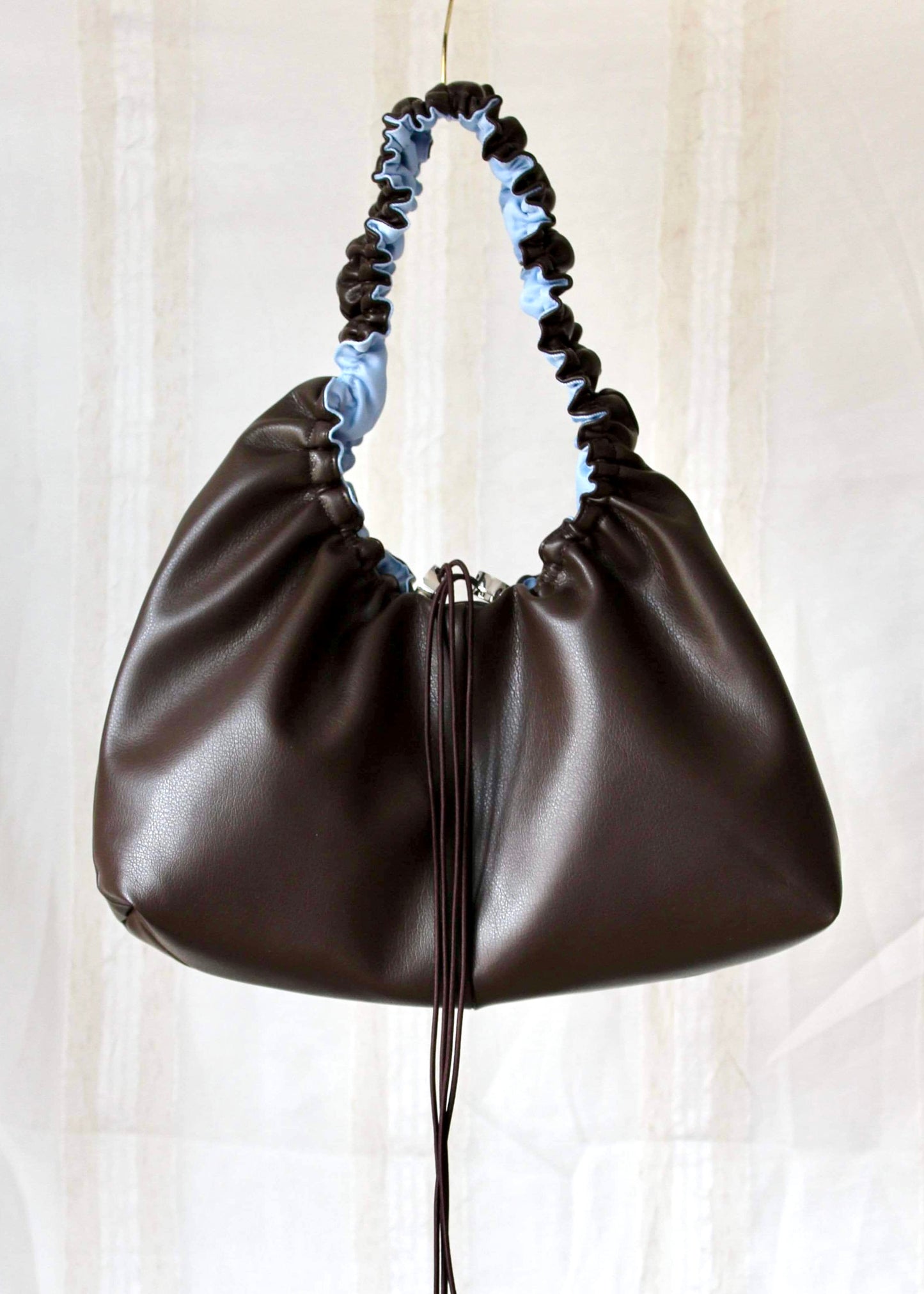 Dark brown and light blue bag