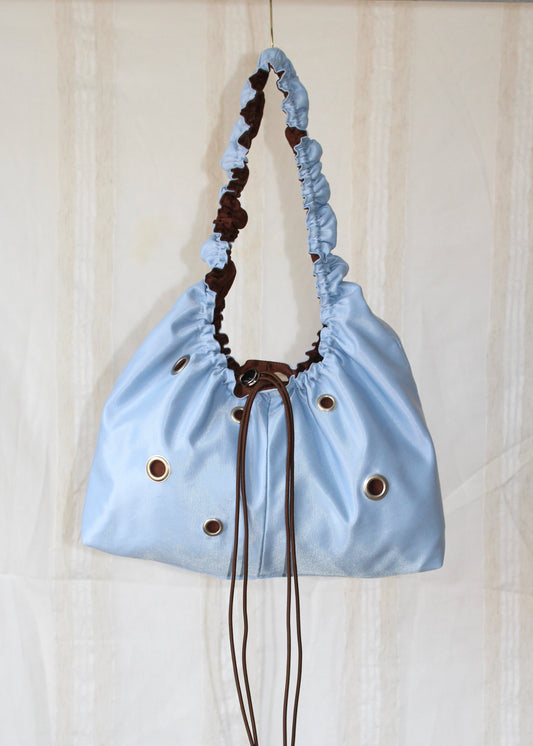 Light blue and brown bag