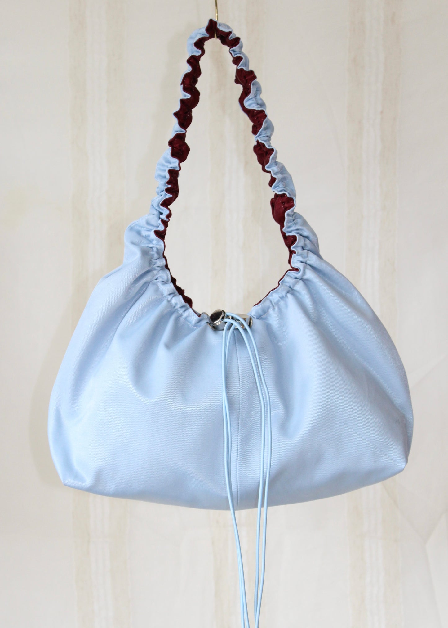 Burgundy red and light blue bag