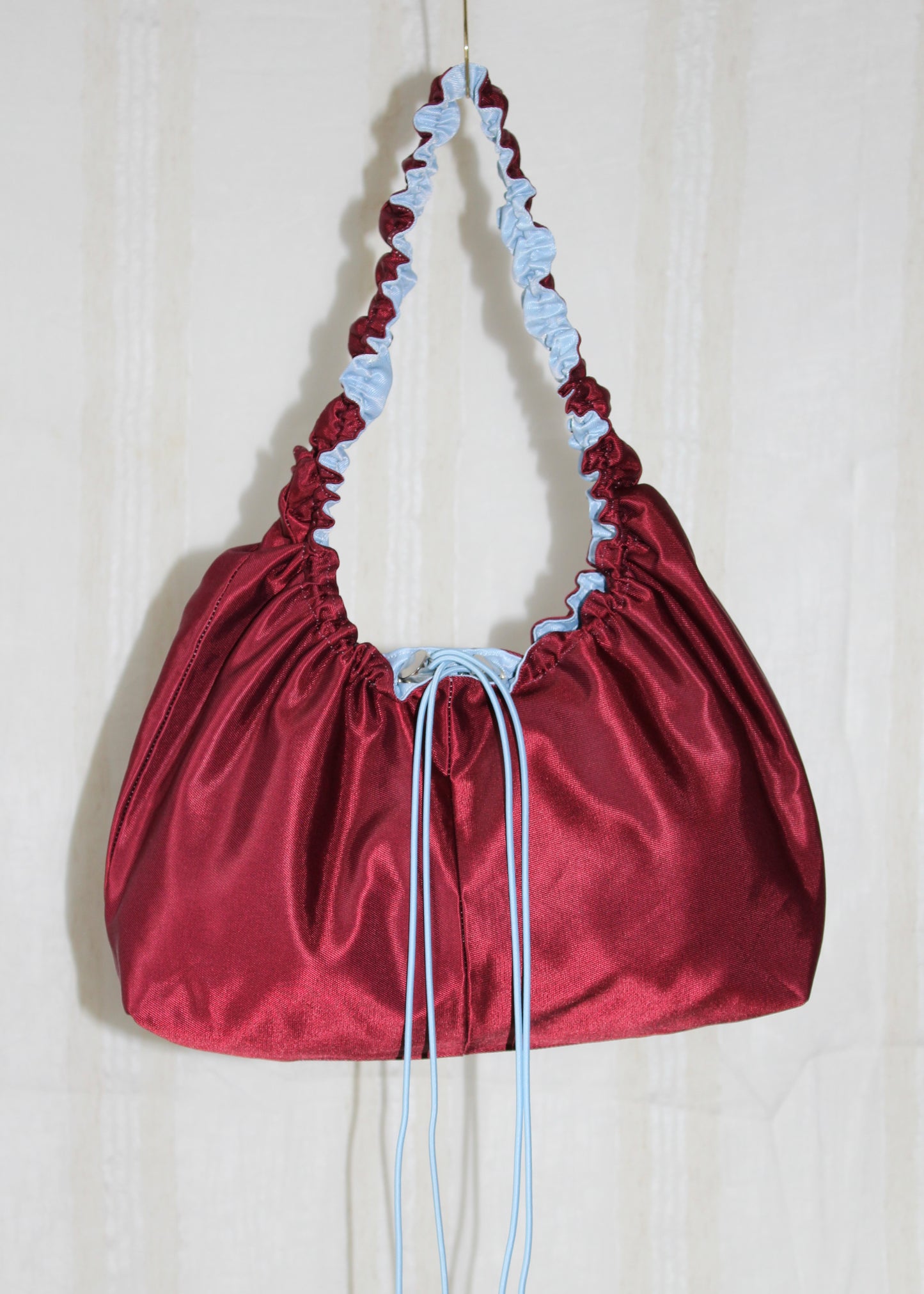 Burgundy red and light blue bag