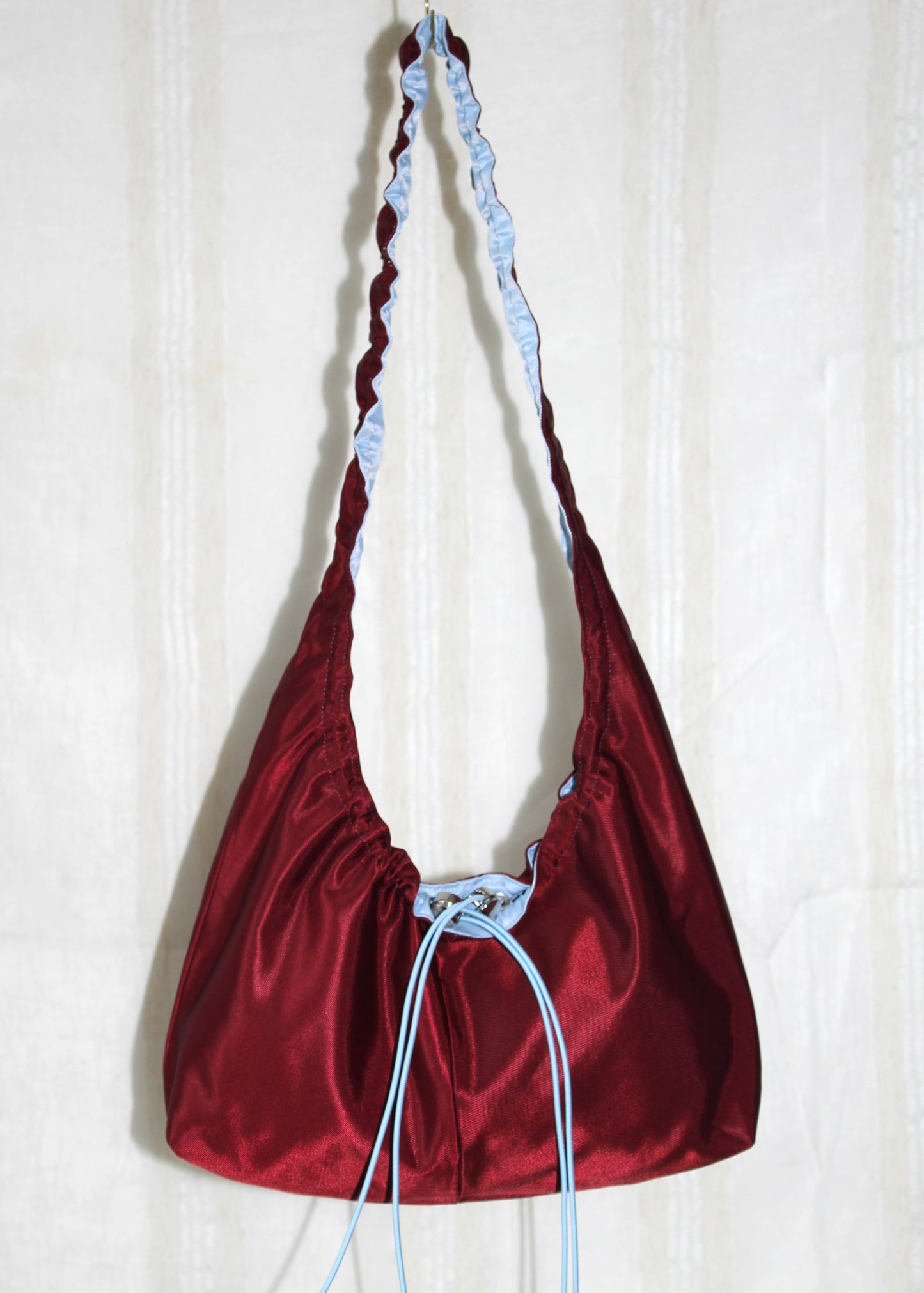 Burgundy red and light blue bag