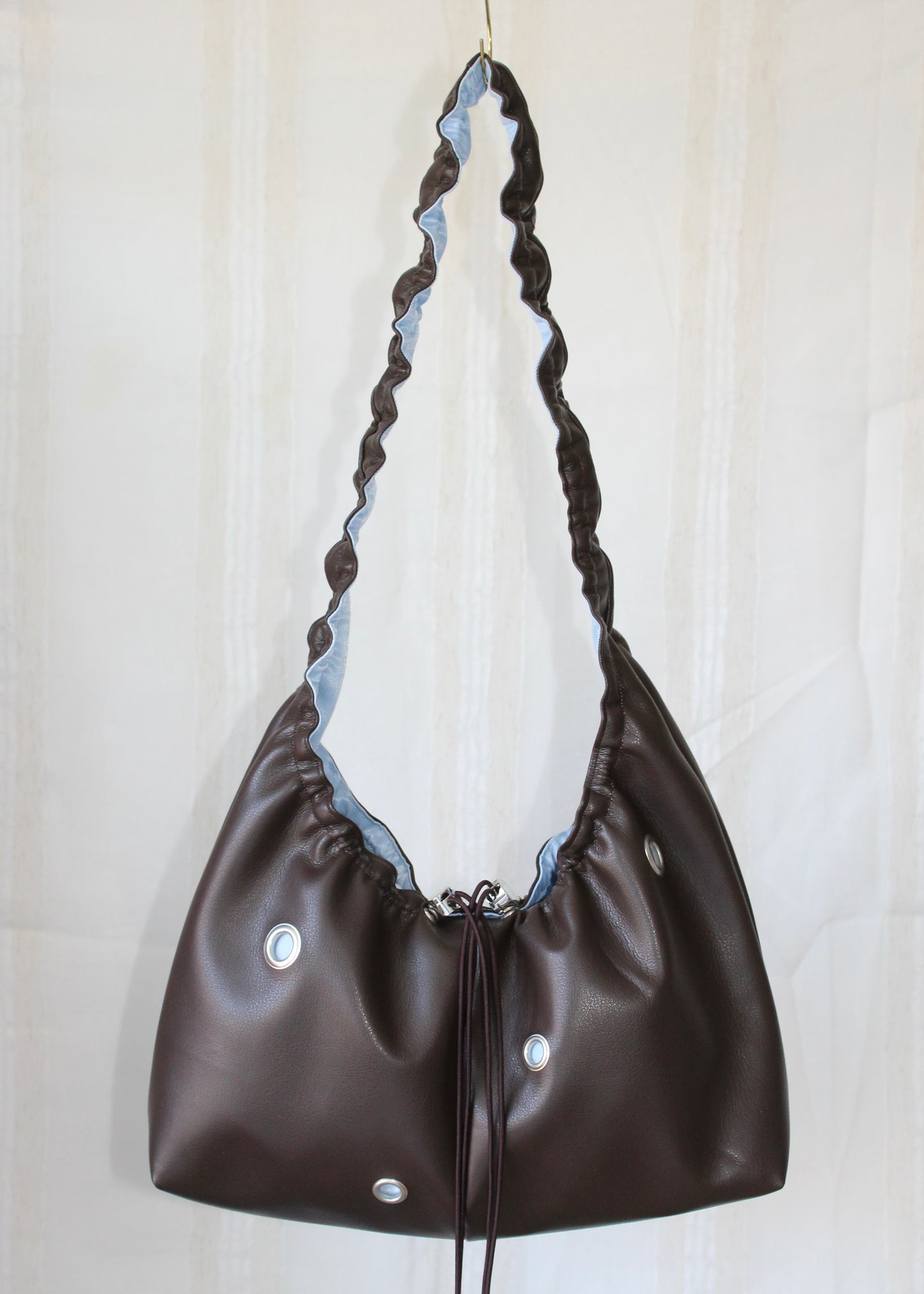 Dark brown and light blue bag